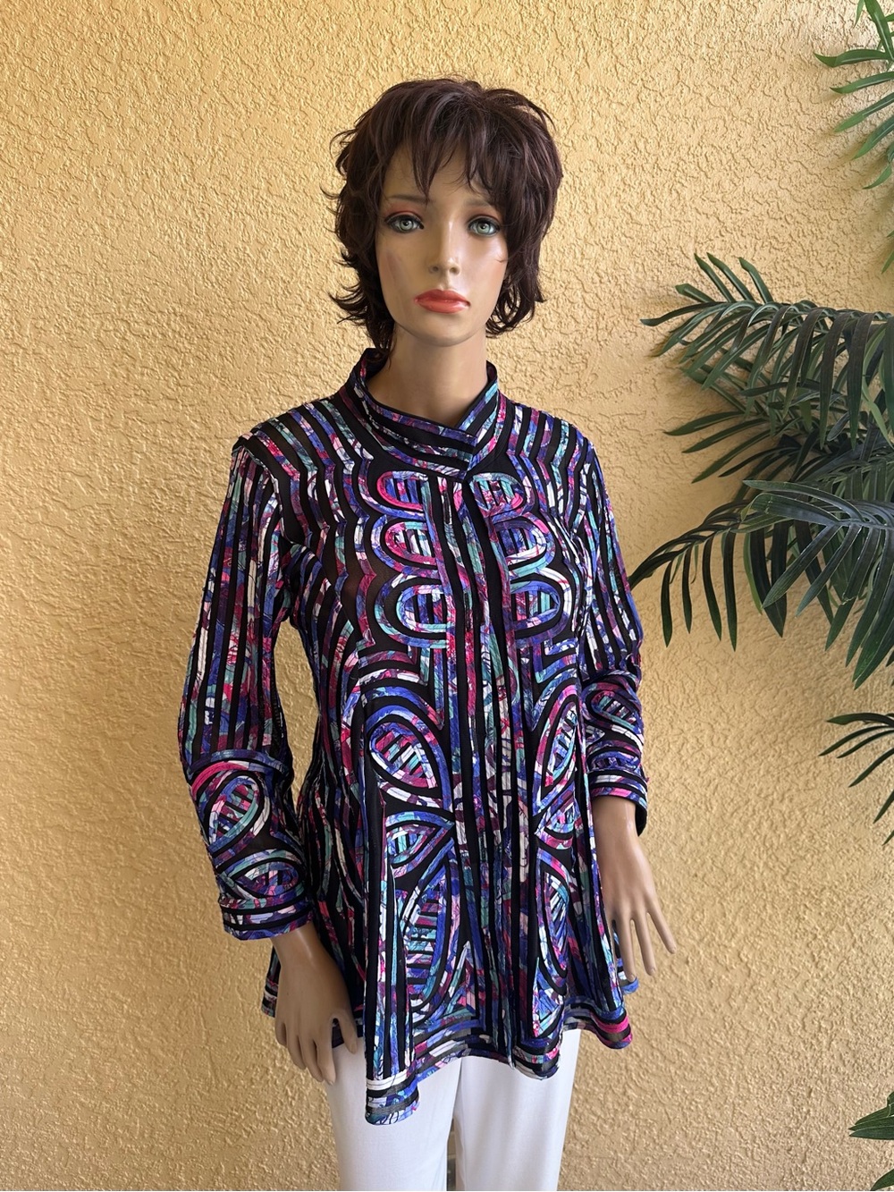 Weavz designs colorful jacket of fabric ribbon over black mesh lining